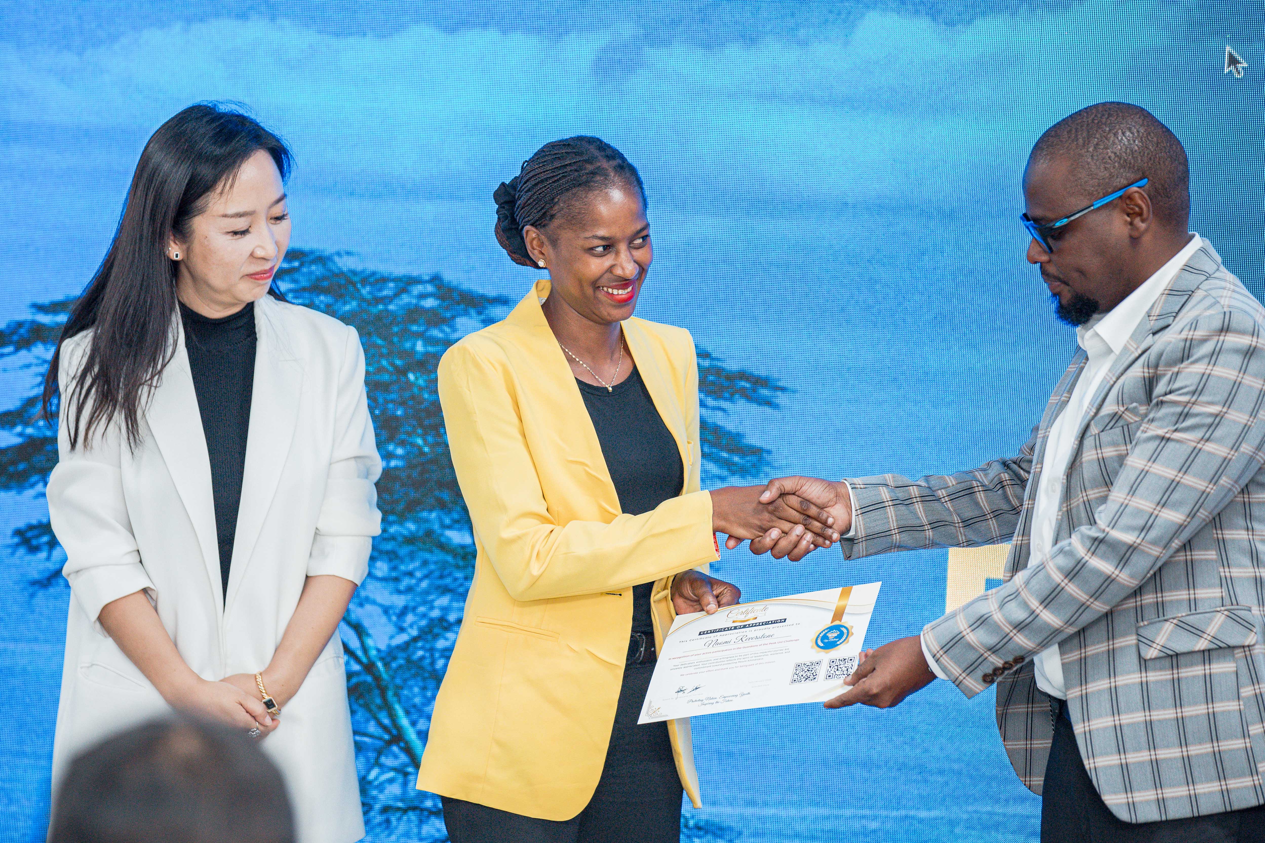 University Students receive Guardians of the Peak certificates.